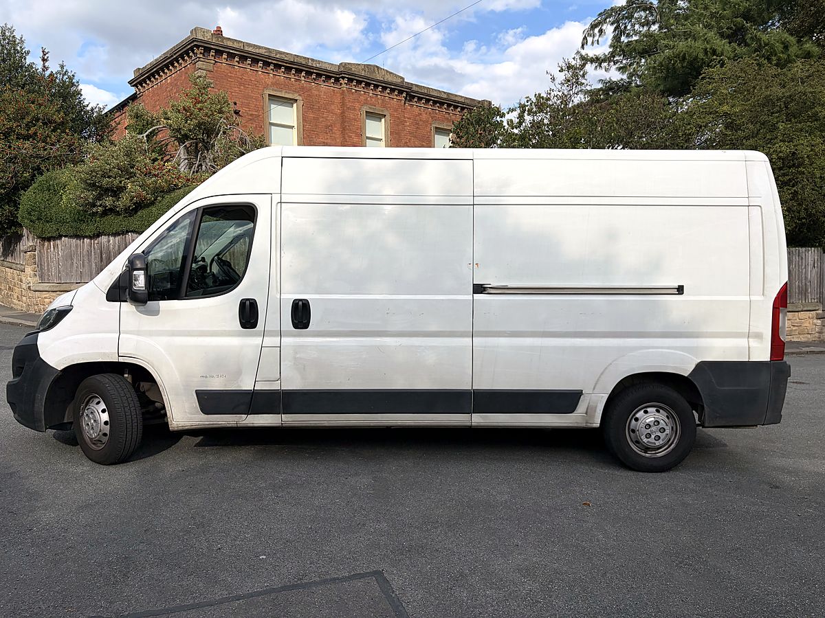 White long-wheelbase Peugeot Boxer L3H2 van, side view